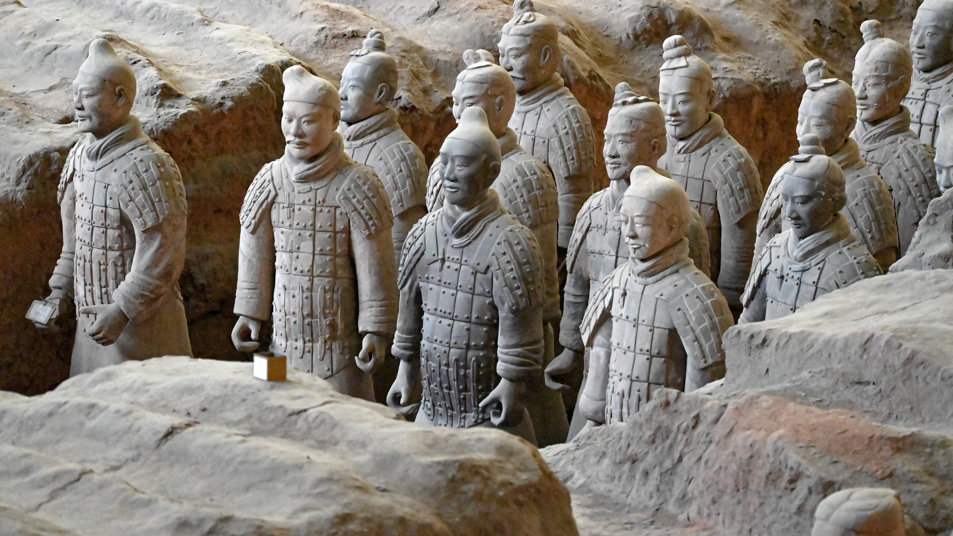 Rows of terracotta figures and earthen dividing walls inside the Xi'an warriors pit