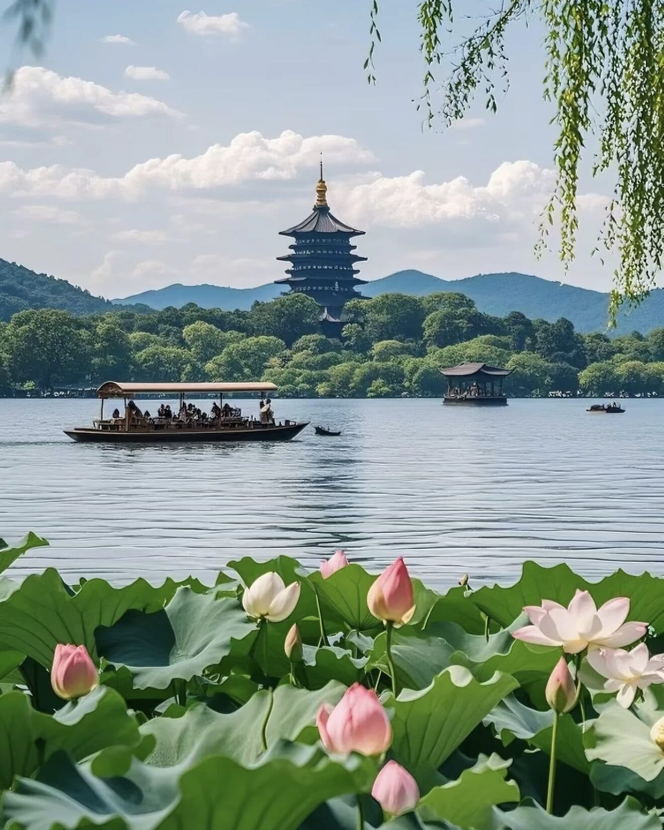 Leifeng Pagoda across West Lake, a tour boat on the water, and lotus flowers in the foreground