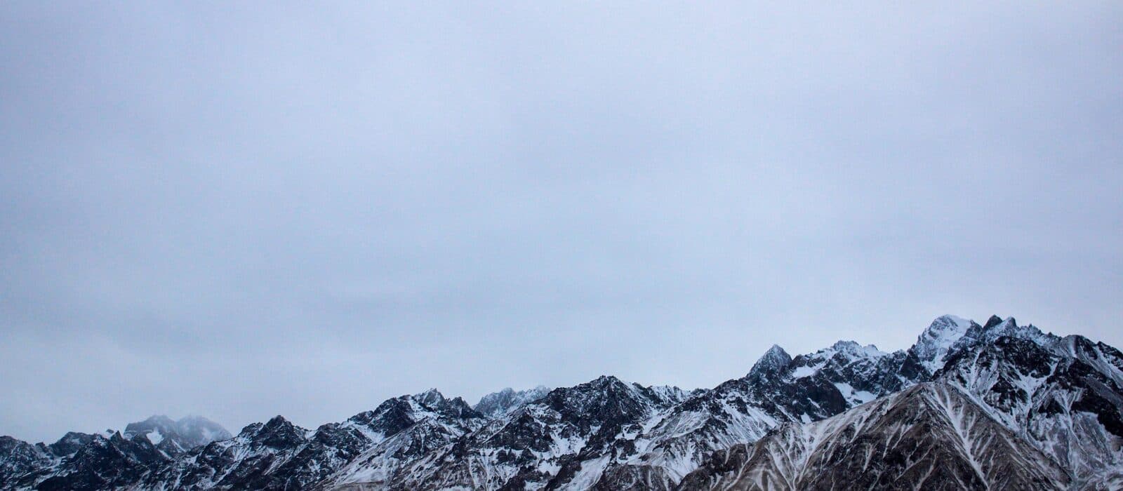 Snow-covered mountain ridges toward Kashgar