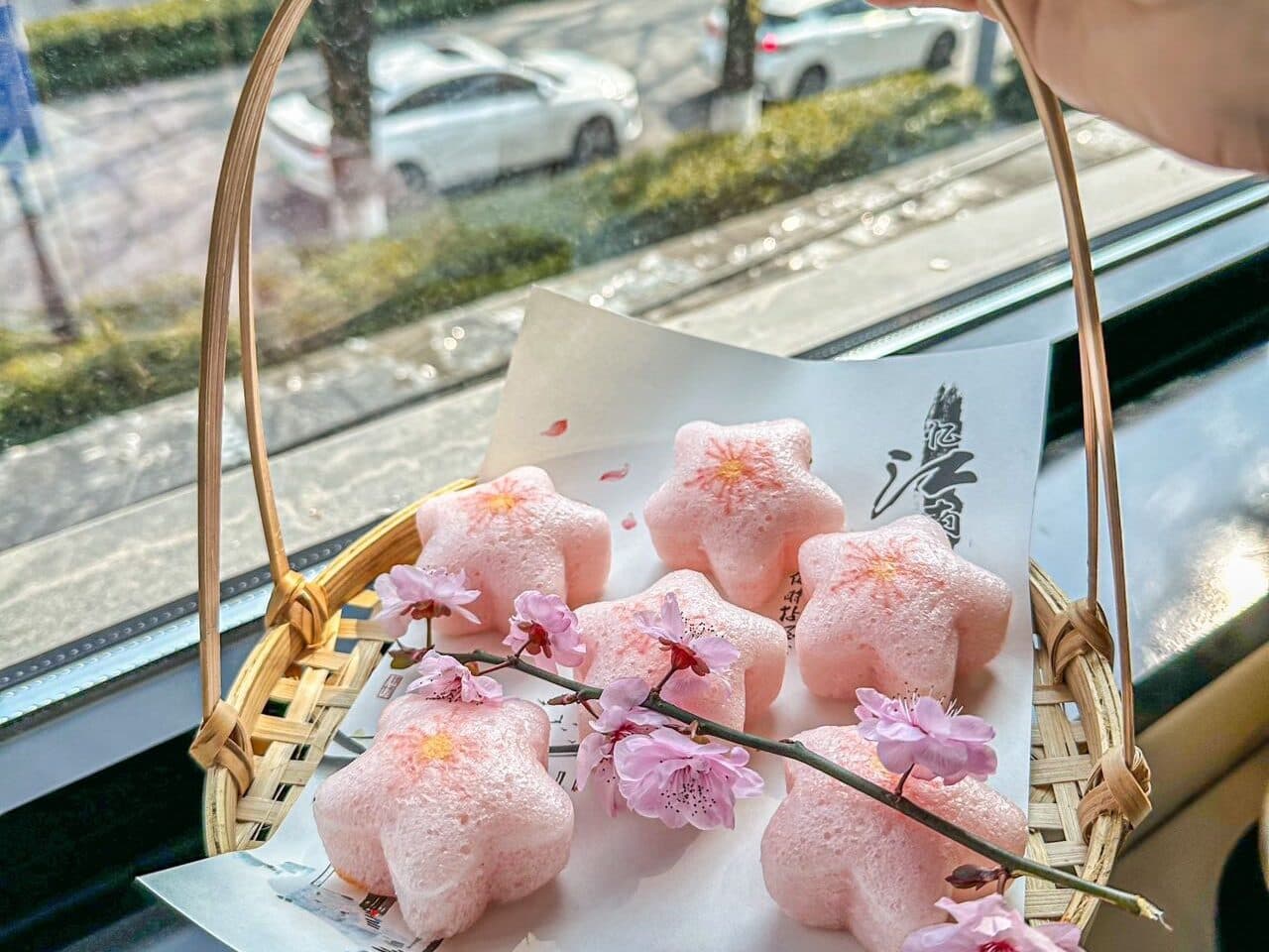 Peach-blossom pastries in a bamboo basket, arranged in rows