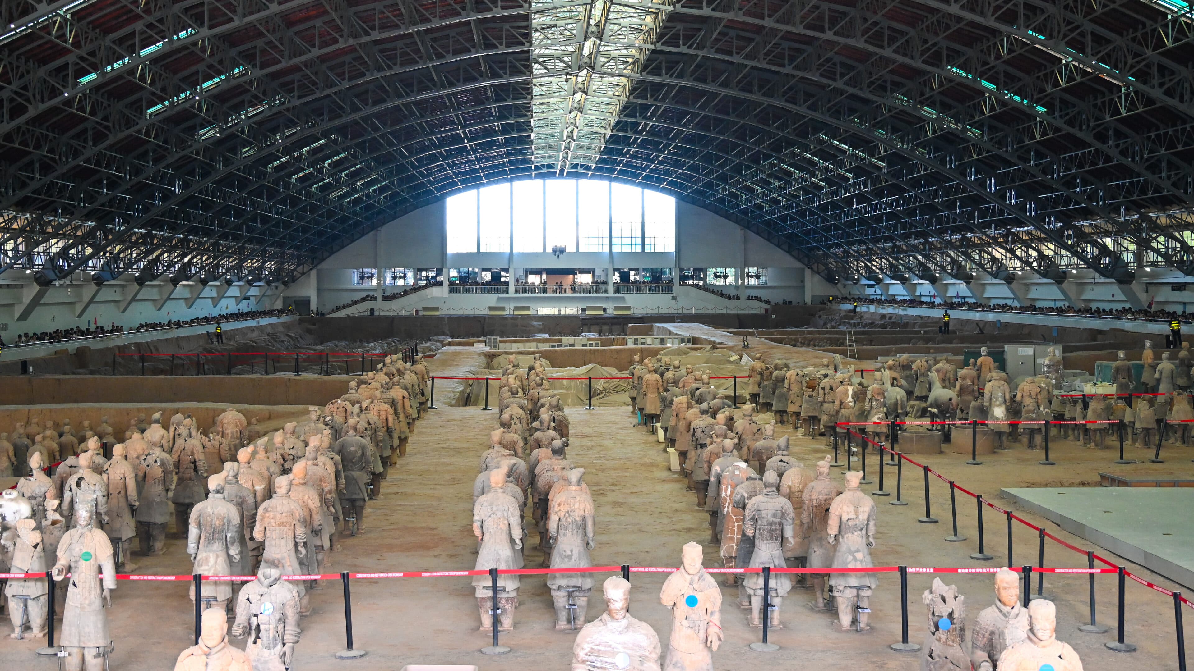 The pit-one hall at the Terracotta Army, arched steel roof and visitor crowd above