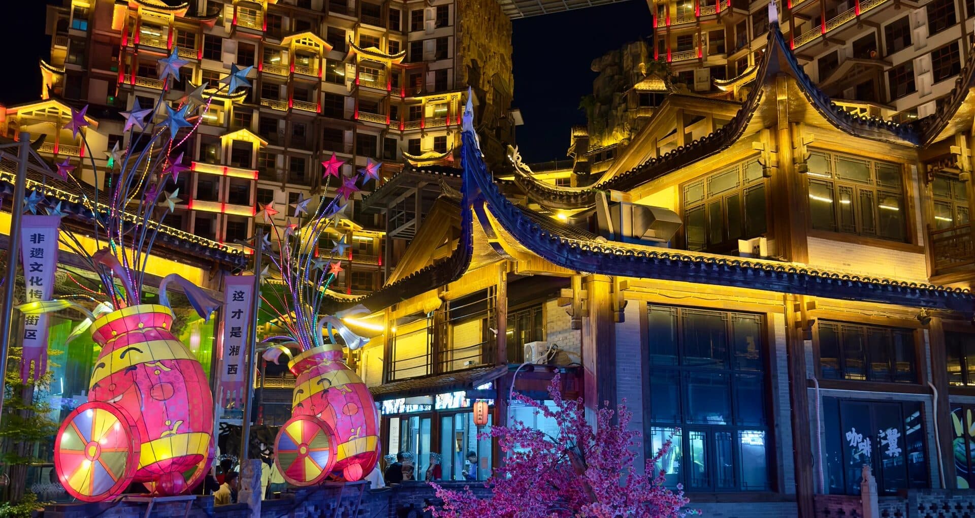 Lit pavilions and lanterns on a Zhangjiajie night street