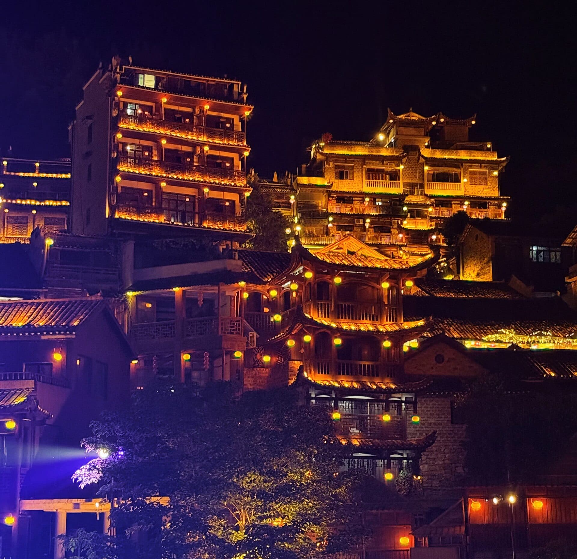 Lit hillside pavilions of the old town at night