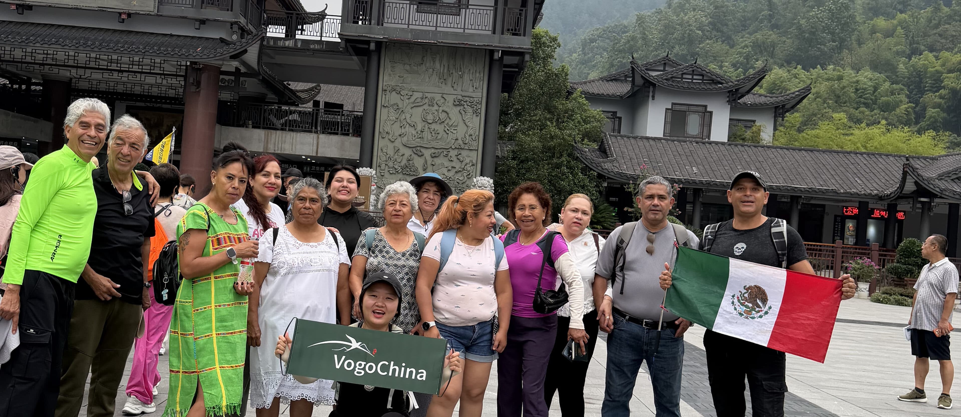 Tour group gathered in front of the Wulingyuan gate buildings