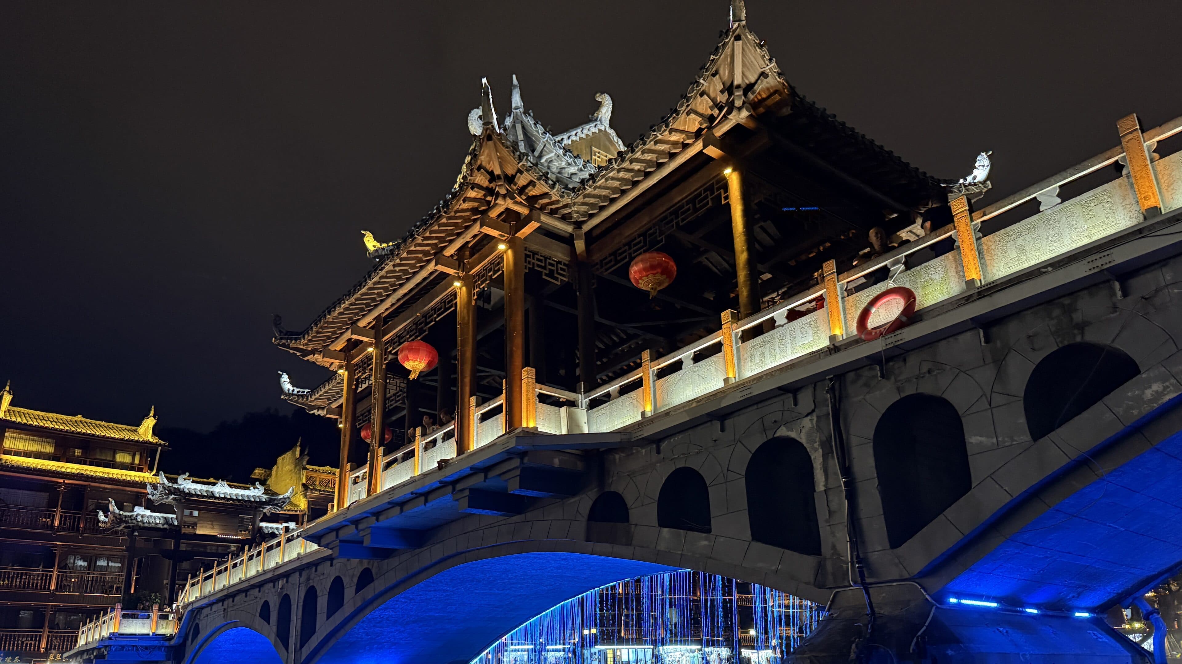 Western Hunan ancient-town evening scene for a longer Zhangjiajie trip