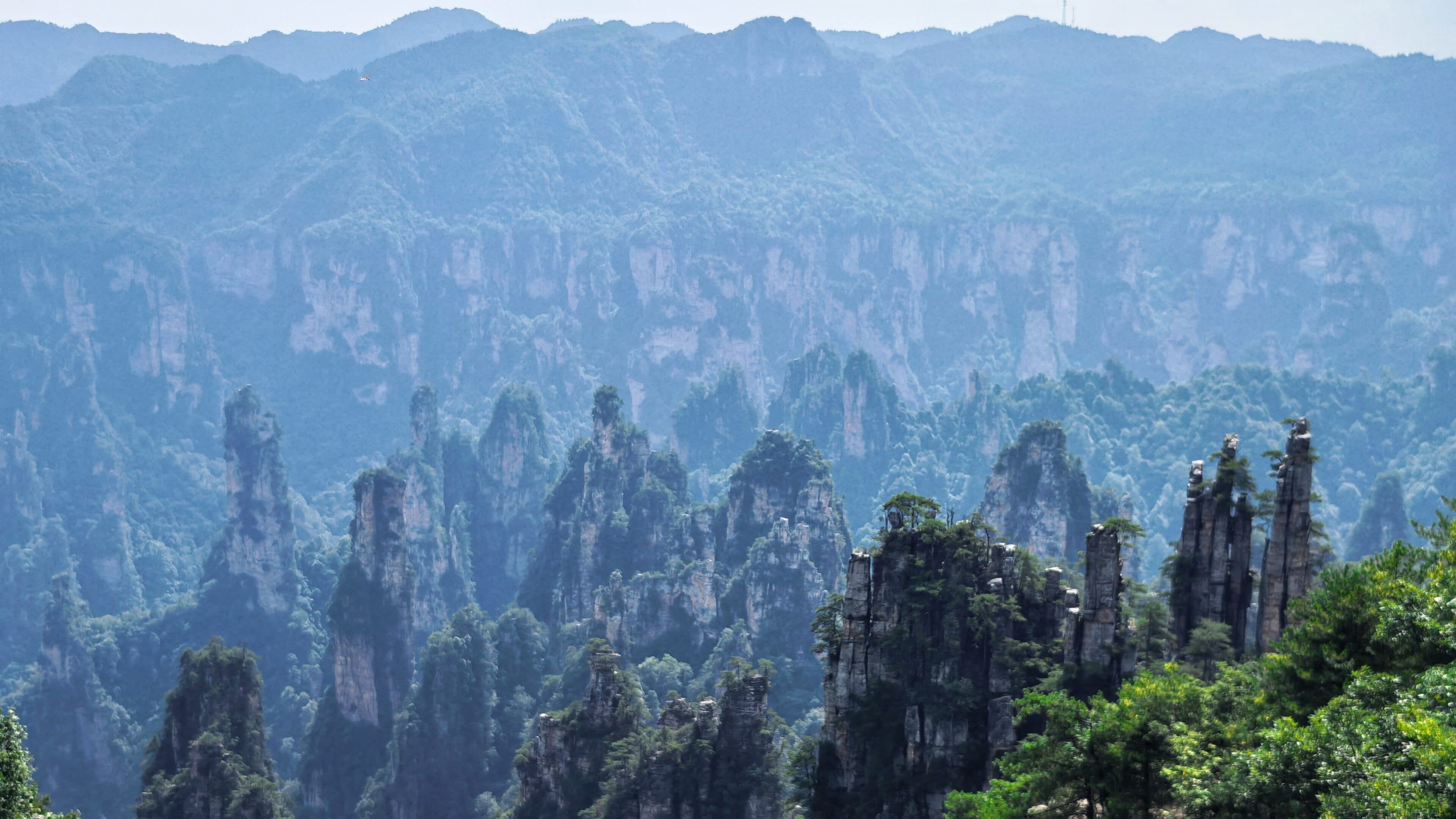 Mist lifting around sandstone pillars