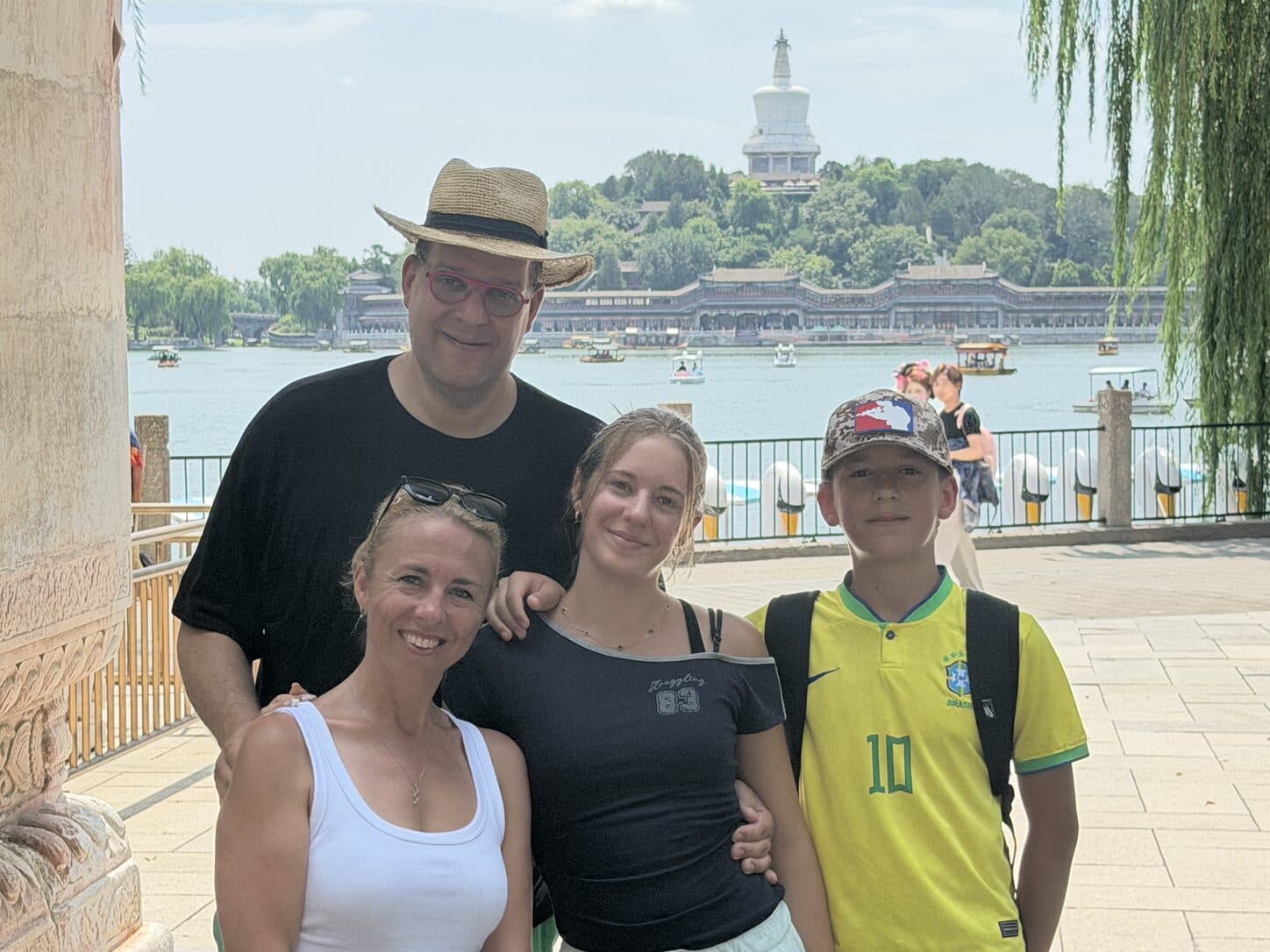 A family of four beside a lake in Beijing