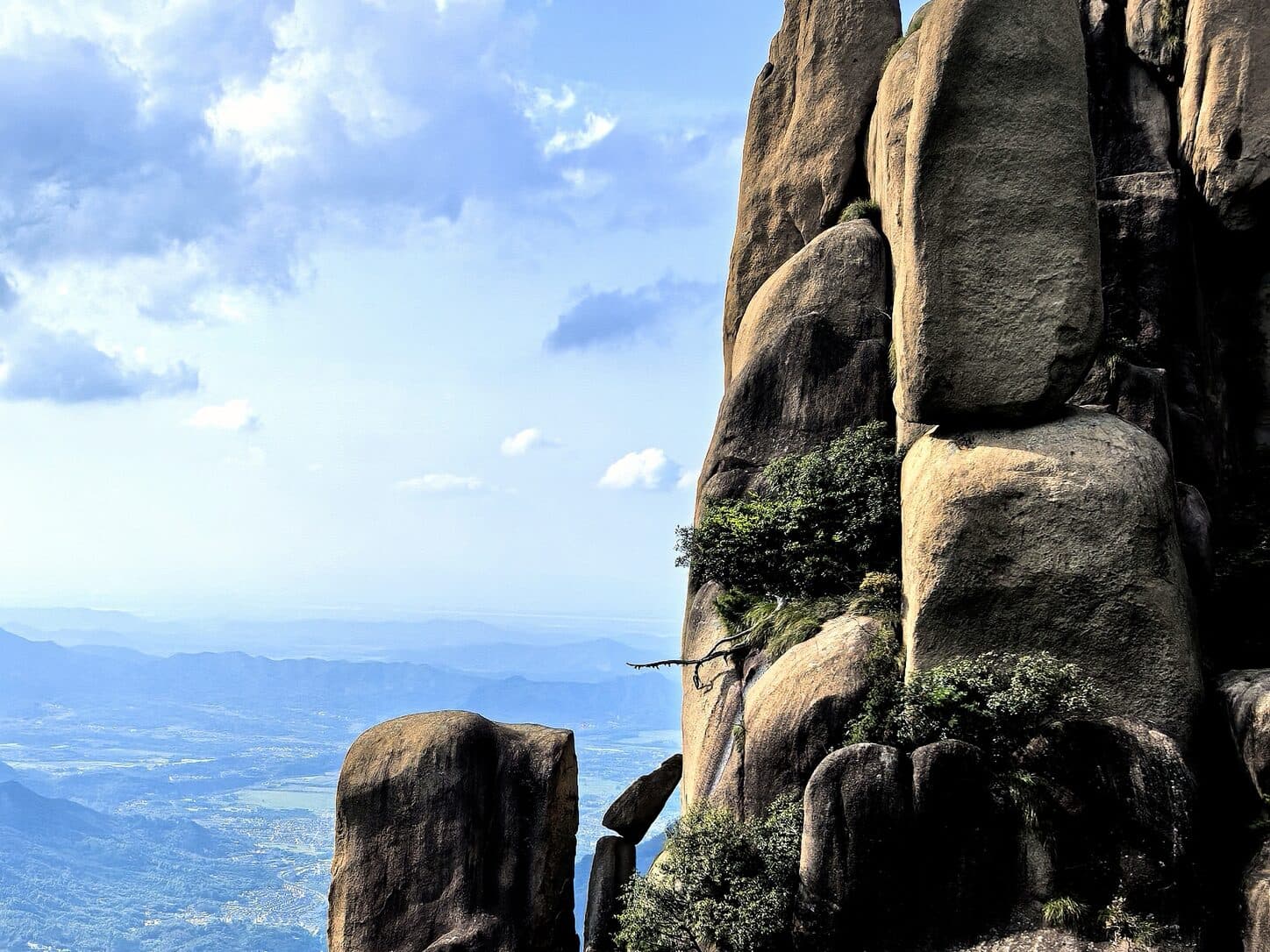 Granite peaks and a wide valley under a blue sky